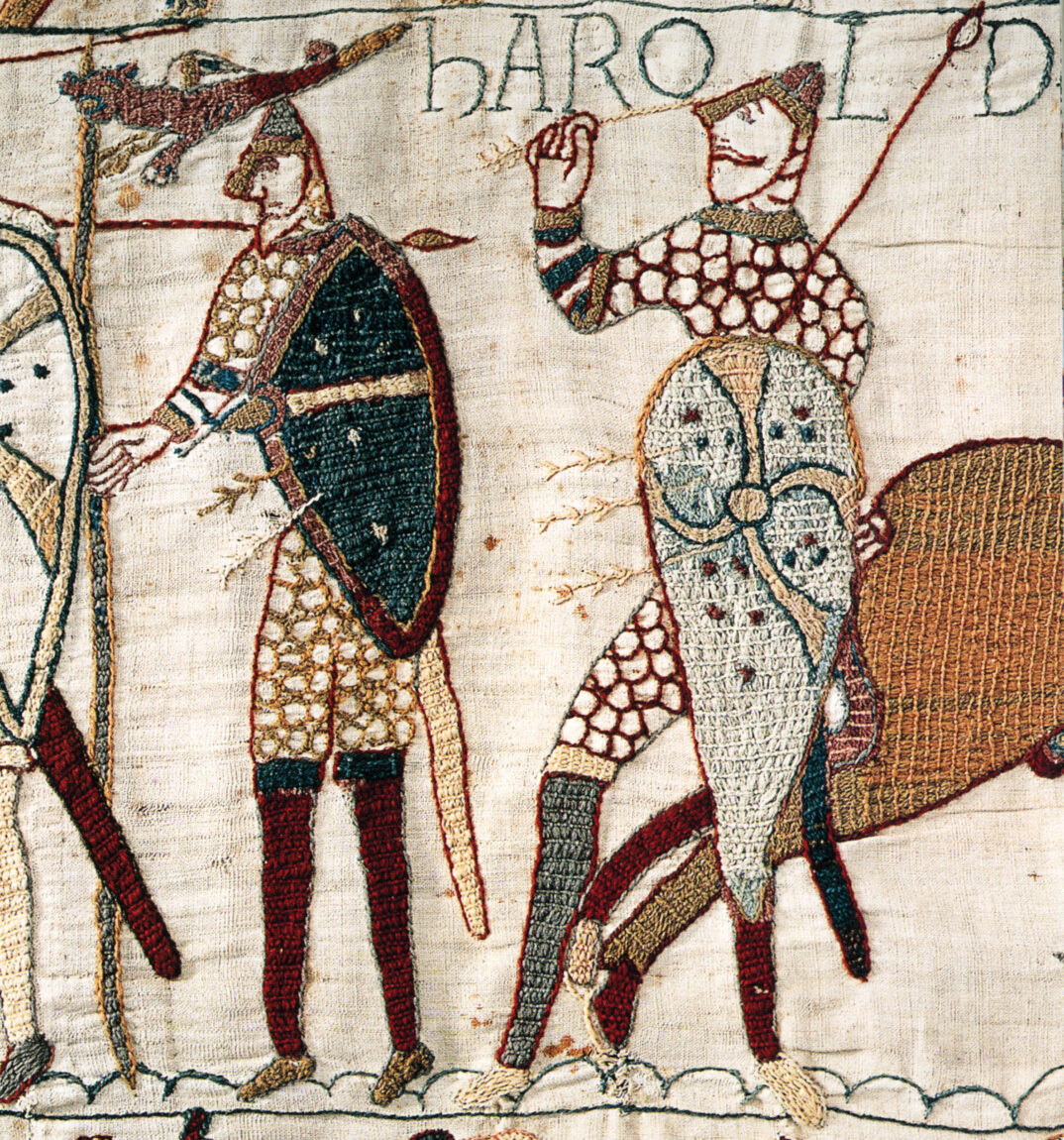 Anglo-Saxon King Harold, right, was struck in the eye by an arrow during the Battle of Hastings. More arrows pierce his shield and the shield of the knight to the left.