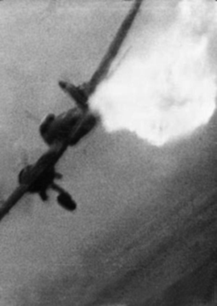 The gun camera of Squadron Leader J.A.F. McLachlan captures the last moments of a German Junkers Ju-88 bomber flying over France in June 1943. McLachlan scored this aerial victory while flying a Supermarine Spitfire.