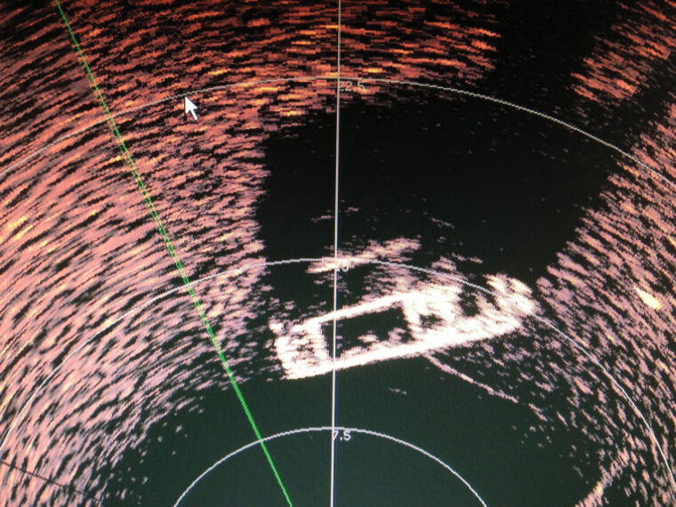 Photo taken by the sonar camera on December 12, 2012, when the Volontari del Garda finally hit paydirt; the image of the DUKW is plainly visible. The grainy images around the DUKW were first thought to be human remains but photos from the ROV (Remotely Operated Vehicle) confirmed that they were construction cinder blocks used to anchor buoys for sailboat races over the decades. 