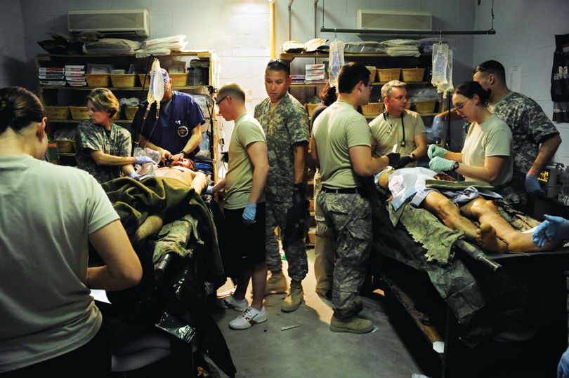 Wounded Afghan soldiers receive medical treatment from Forward Surgical Tem medics in April 2010.