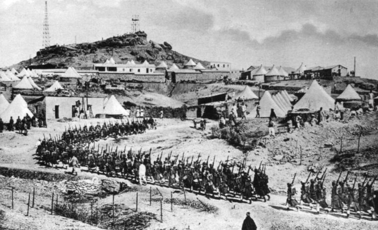 A column of French troops moves to a tented encampment in Morocco. The French made a heavy investment in men and materials to put down well-organized Moroccan rebels.