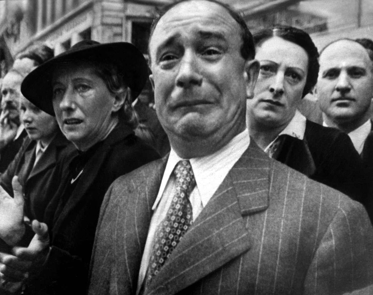 A still from Frank Capra’s film, Divide and Conquer, the third film in the Why We Fight series, shows French civilians watching as the French Army leaves France from Toulon Harbor in 1940, later to become part of the Free French forces.