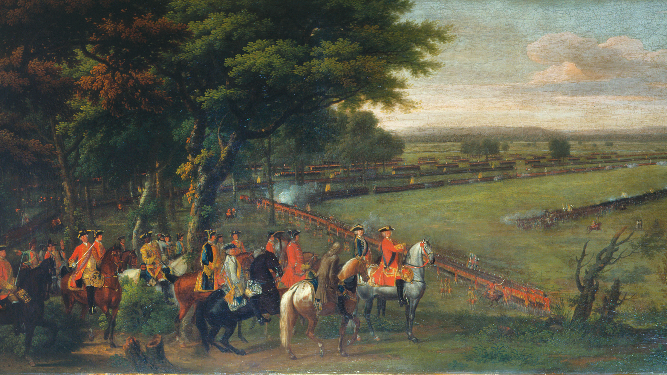 King George II is shown giving orders to his generals in a period painting of the Battle of Dettingen. Puffs of white smoke are visible as individual companies discharge their muskets into the opposing enemy ranks. Like many period renderings of linear warfare, this painting by David Morier fails to convey the chaos of battle.