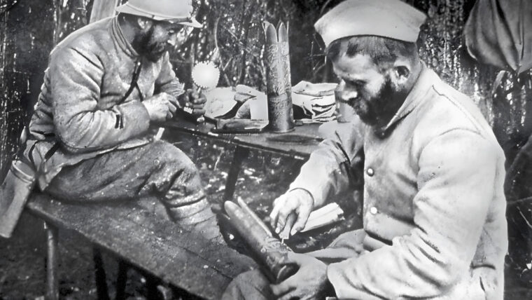 World War I French soldiers make flower vases from shell casings.