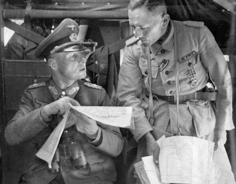 Rommel confers with a staff officer during the siege of Tobruk. 