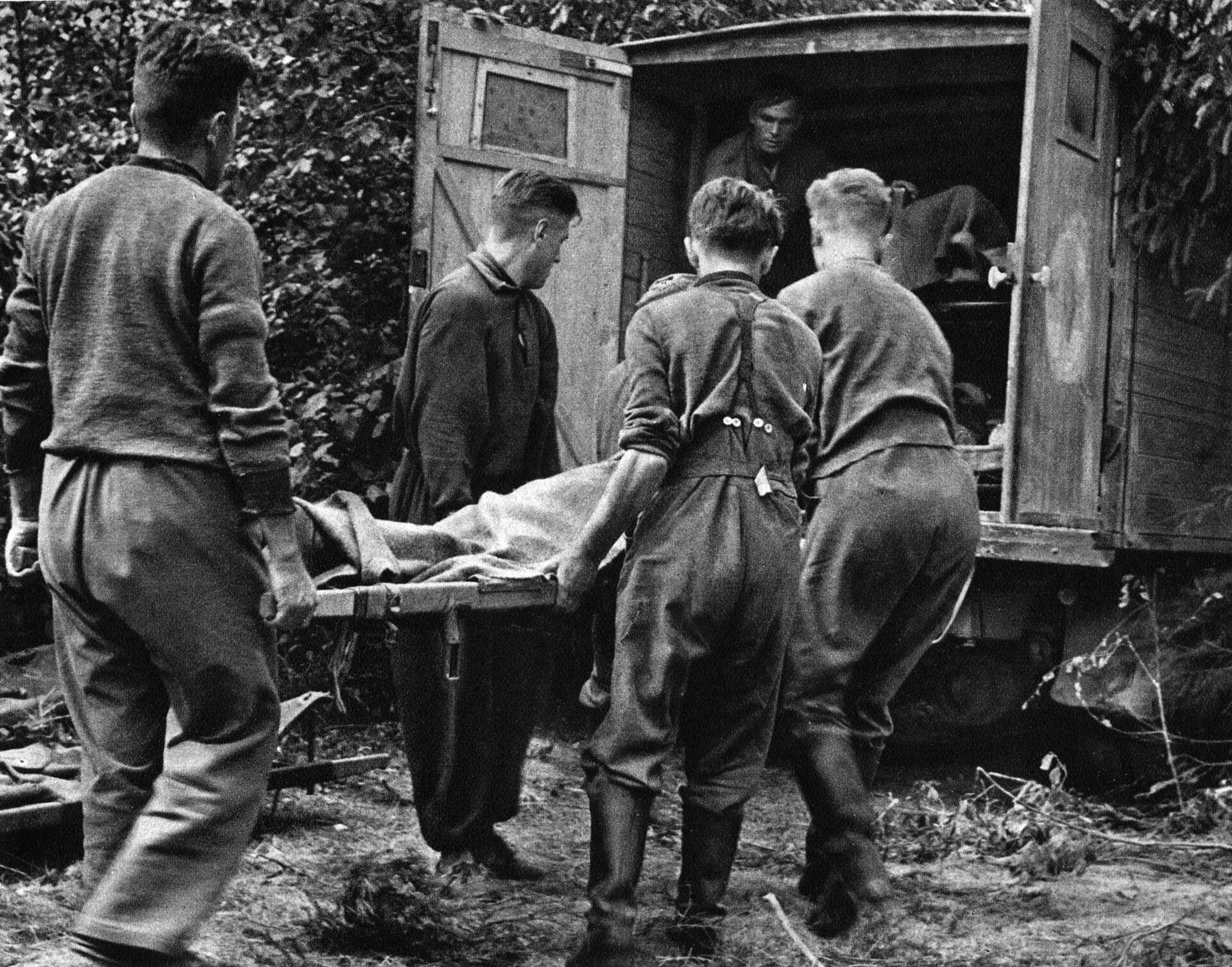 German medics load a battle casualty into a field ambulance. Heavy losses and the oncoming brutal winter weather would halt the German advance short of Moscow. 