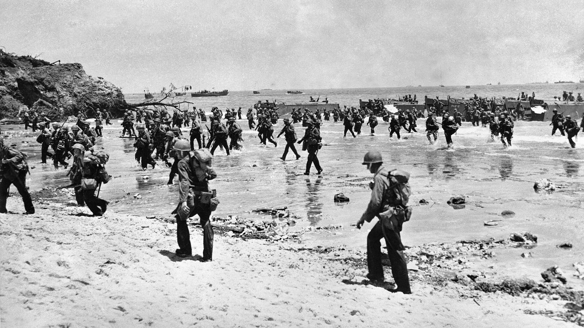 Members of the 81st Infantry Division wade ashore calmly, suggesting that this photo was taken sometime after the initial landings, when hostilities along the beachheads had quieted considerably.