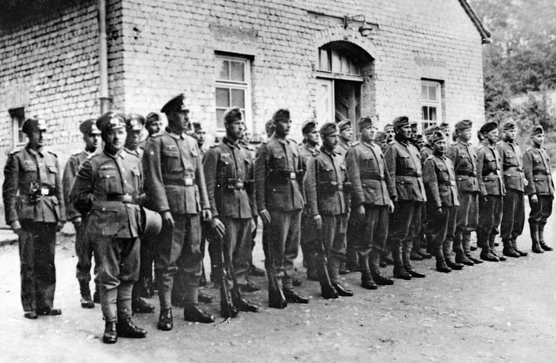 The officers and guards at Stalag IX-B in formation. Most German POW camps, while not resorts, were at least run humanely; Stalag IX-B was notorious for its harsh treatment of prisoners. 