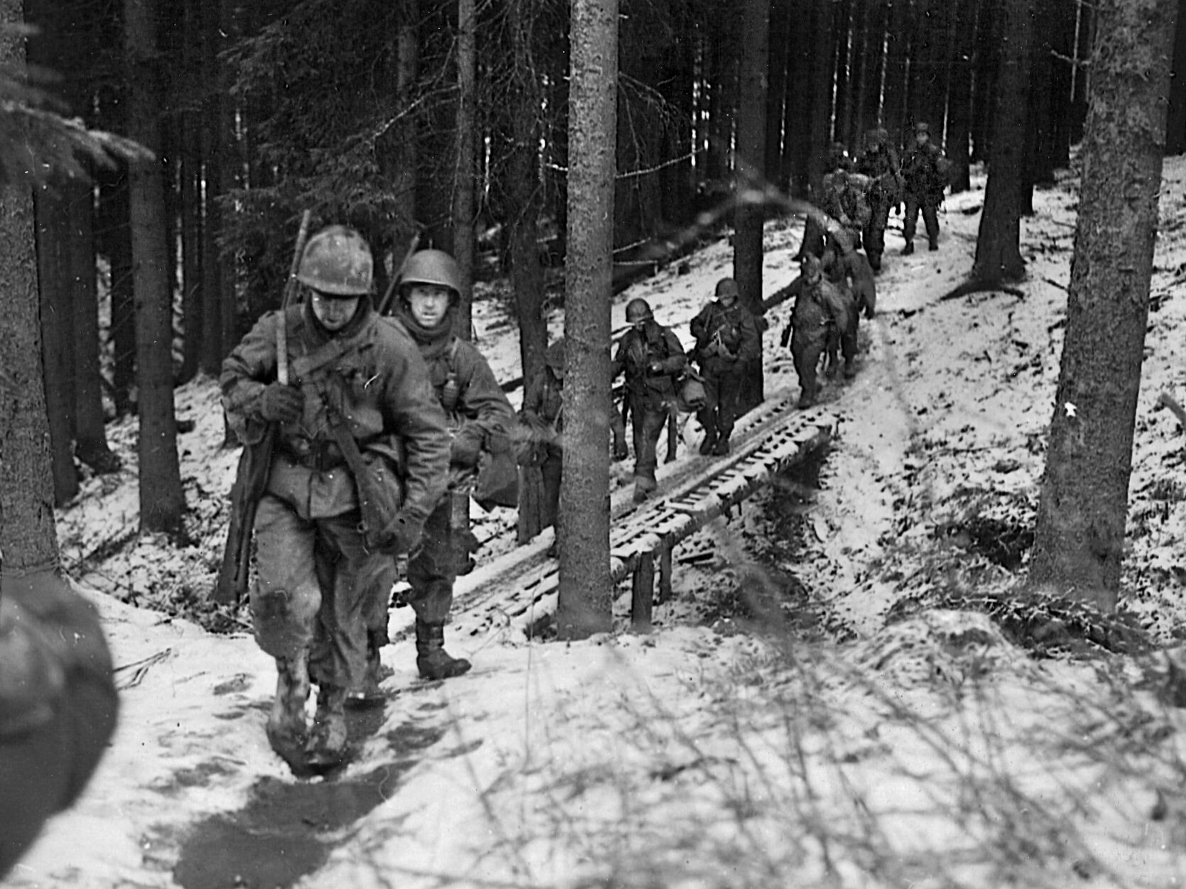 The 106th Infantry Division was totally new to combat and stood no chance against the overwhelming number of Germans. Here, a unit from the 106th patrols near St. Vith, Belgium, December 1944.