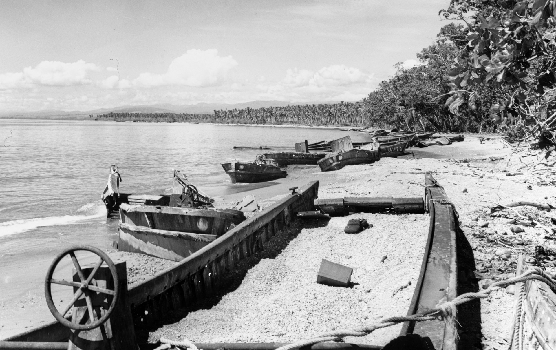 The end of the Guadalcanal campaign came on February 9, 1943, when there were no more enemy troops left to fight. Here, wrecked Japanese landing barges, photographed in May 1942, lie abandoned near Cape Esperance at Guadalcanal’s northern point. 