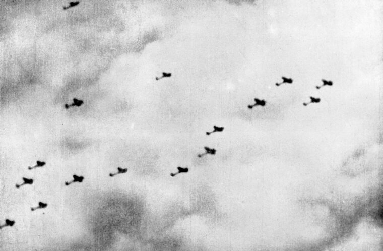 An RAF Spitfire’s gun camera captures a formation of Heinkel IIIs on their way to hit London. The citizens raced for the bomb shelters when the air-raid sirens blared.