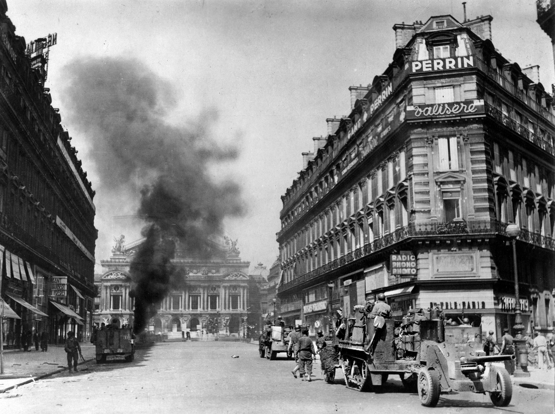  A German tank burns in front of the Paris Opera House after being hit by an anti-tank round. René Champion’s tank was also hit when a grenade was dropped into the open hatch.