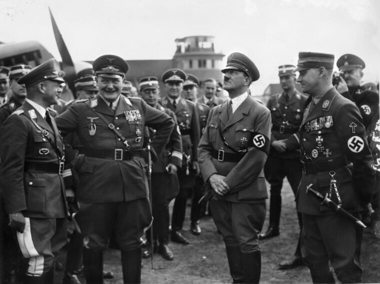 Luftwaffe Field Marshal Erhard Milch, far left, with Hermann Goring, Adolf Hitler, and SA Stabschef Viktor Lutze. Milch, who otherwise would have been considered a “half-Jew” or Mischlinge, was “aryanized” by Hitler, who claimed the power to change an individual’s ethnicity.