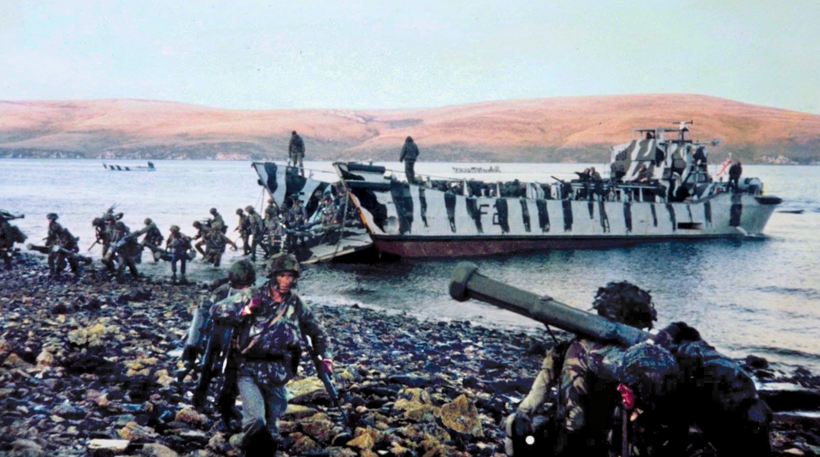 By June 10, British troops were in place on a line of hills west of the Argentine defenses surrounding Port Stanley. No. 3 Parachute Regiment, shown disembarking from a landing craft at San Carlos, attacked from the west.