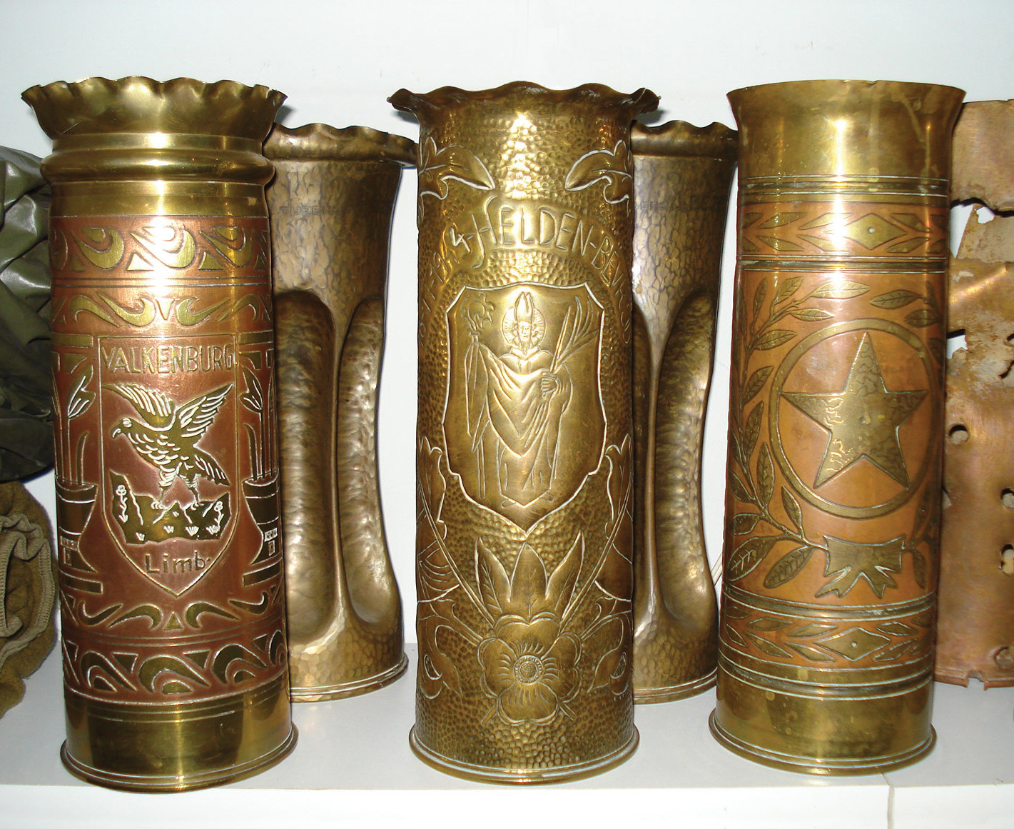 Brass shell casings, which were in great abundance in the world wars, form the bulk of 20th-century trench art. These shell casings have been transformed into sculptures.