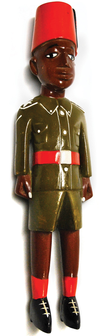 A wood figure dating from World War I depicts a French colonial soldier. 