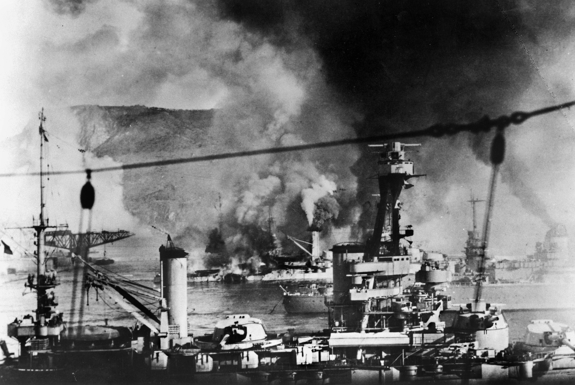 Vichy French warships burn in Mers el-Kebir harbor, French Algeria, on July 3, 1940, after being bombarded by British warships to keep them from becoming part of the German Navy. 