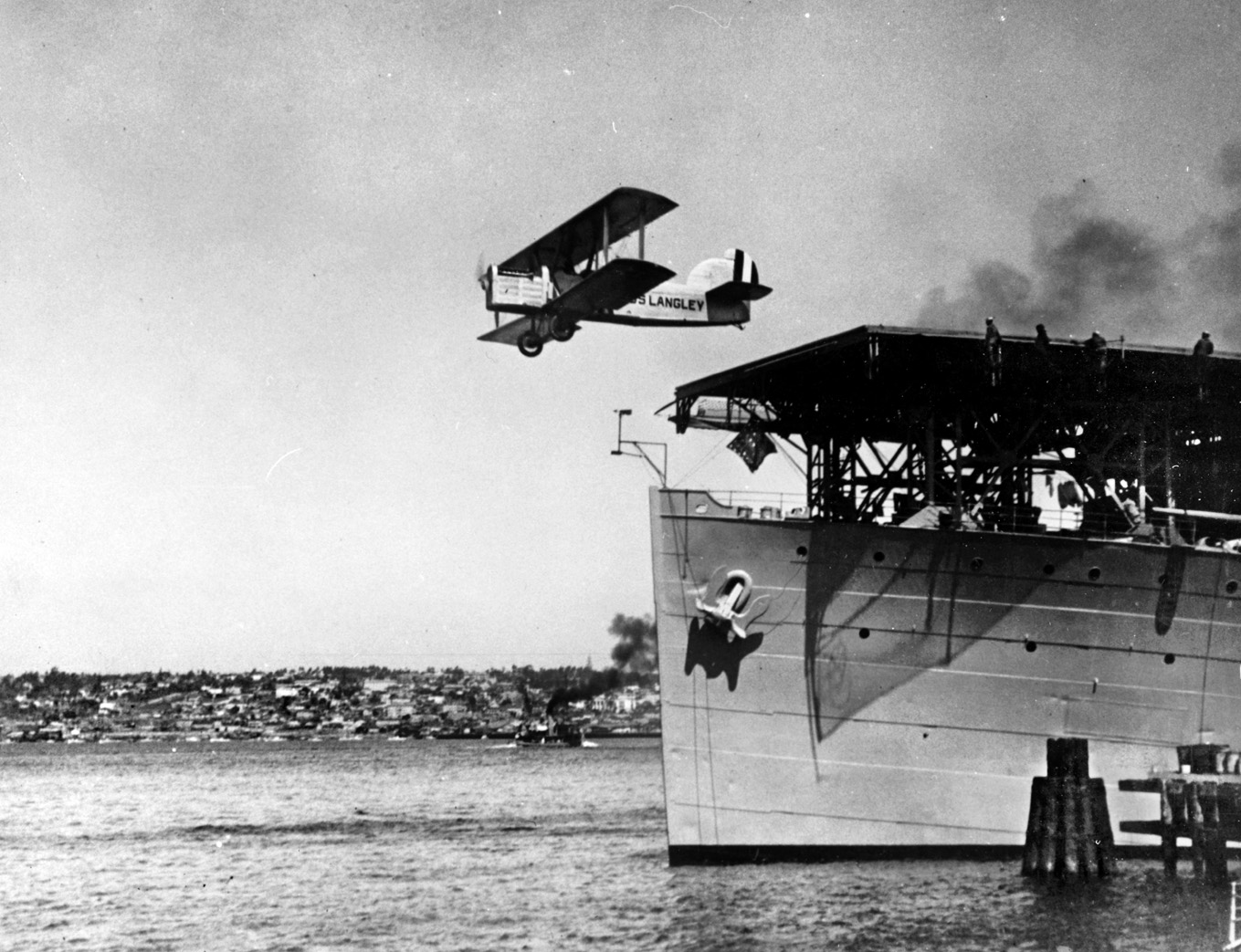 A DT-2 biplane takes off from the deck of the Langley in 1925. A number of pioneer aviators of the U.S. Navy underwent training aboard the Langley and later served during World War II.