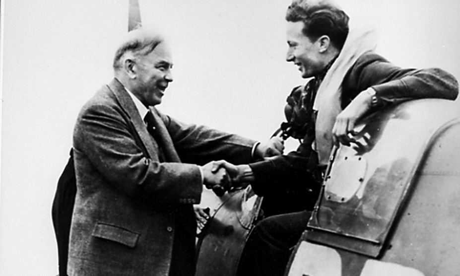 William Ash greeted by Canadian Prime Minister William McKenzie King as he exits the cockpit.