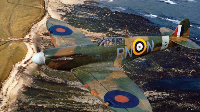 A Spitfire patrols the southern coast of England in April 1941.