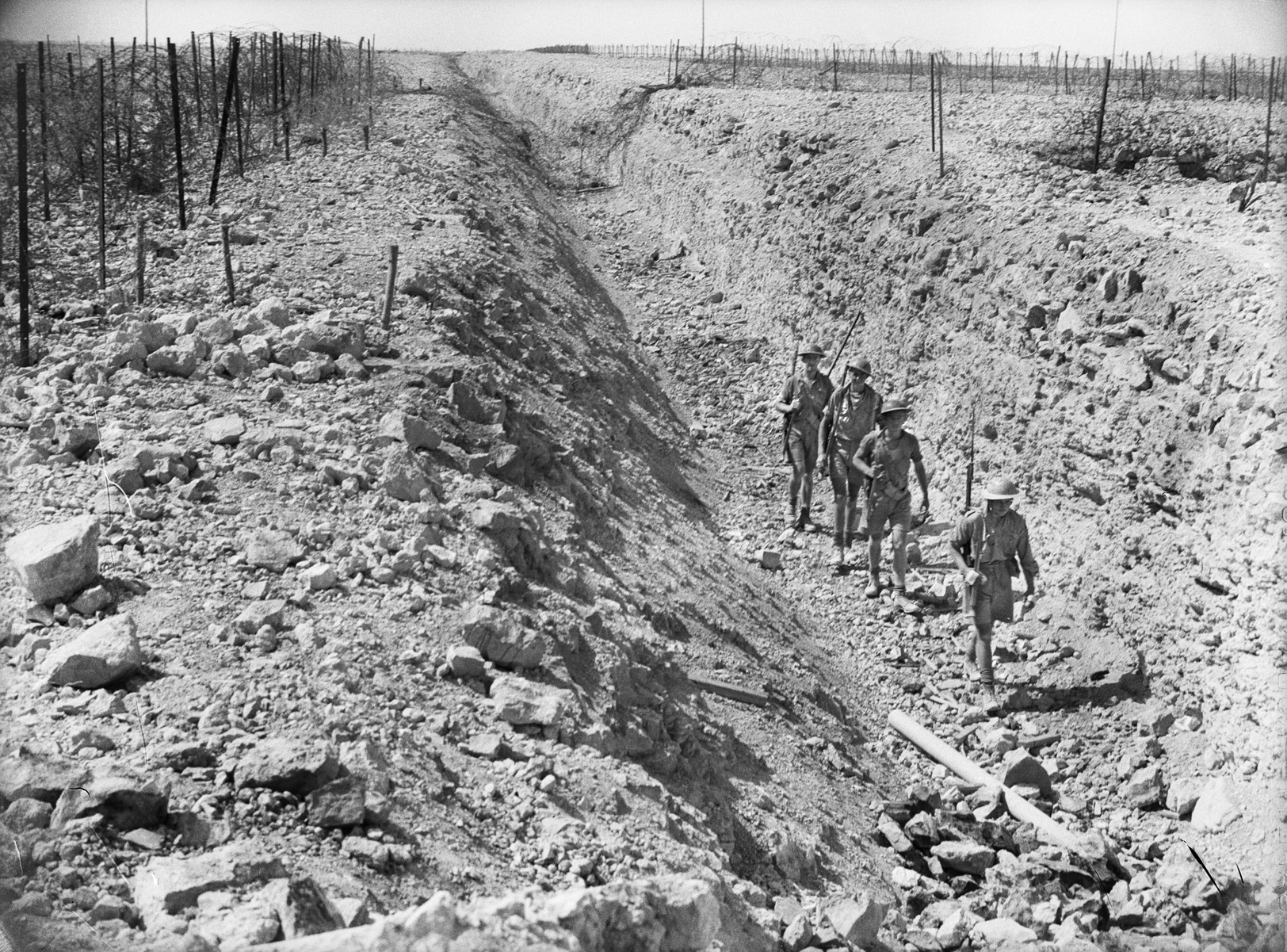 Australian troops march along the bottom of an antitank ditch, which the Italians had dug when they possessed Tobruk.