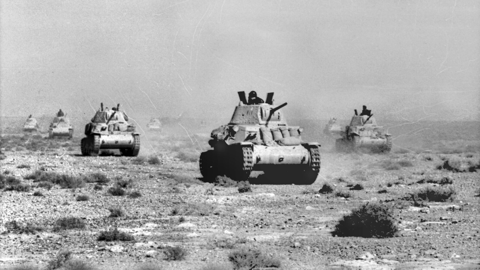 Italian tanks race across the North African desert. The British foiled the Italian invasion of Egypt in September 1940 and by February 1941 had driven the Italians from Libya. 