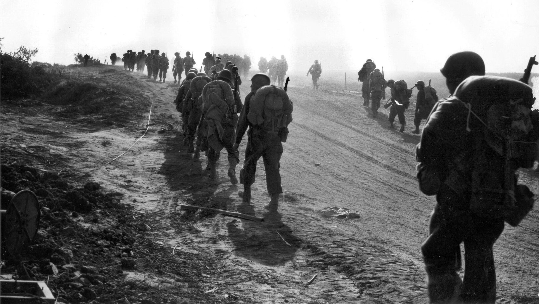 Soldiers of the 100th Infantry Battalion move up to the front near Velletri, Italy, during the breakout from the Anzio beachhead, May 28, 1944.