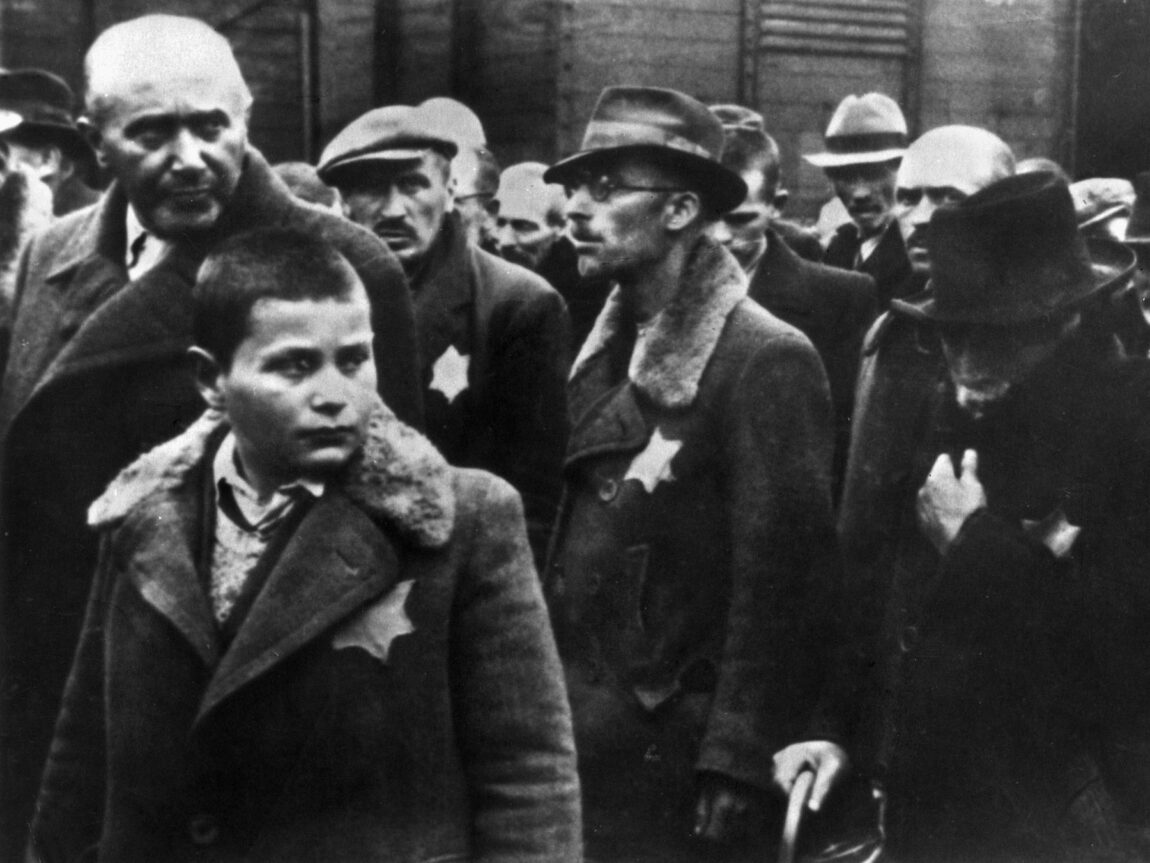 Had the Nazis not persecuted and sent millions of Jews to the death camps, like these men and boys exiting boxcars at an unnamed camp, they might have helped ease the Germany military's manpower shortage.