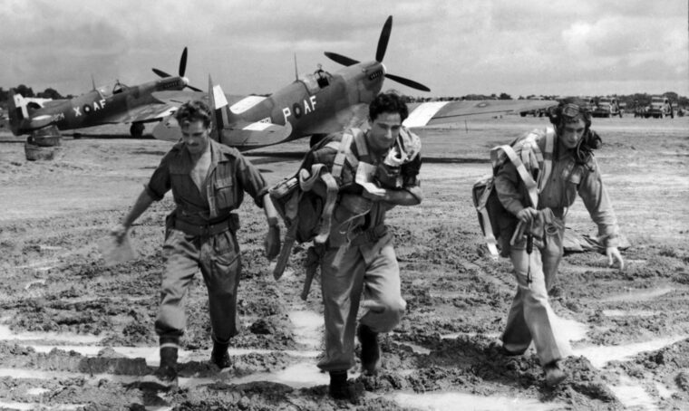 Spitfire pilots are shown with their aircraft in Burma. Although commonly associated with the Battle of Britain, the Spitfire also saw service in British theaters of war around the globe in World War II.