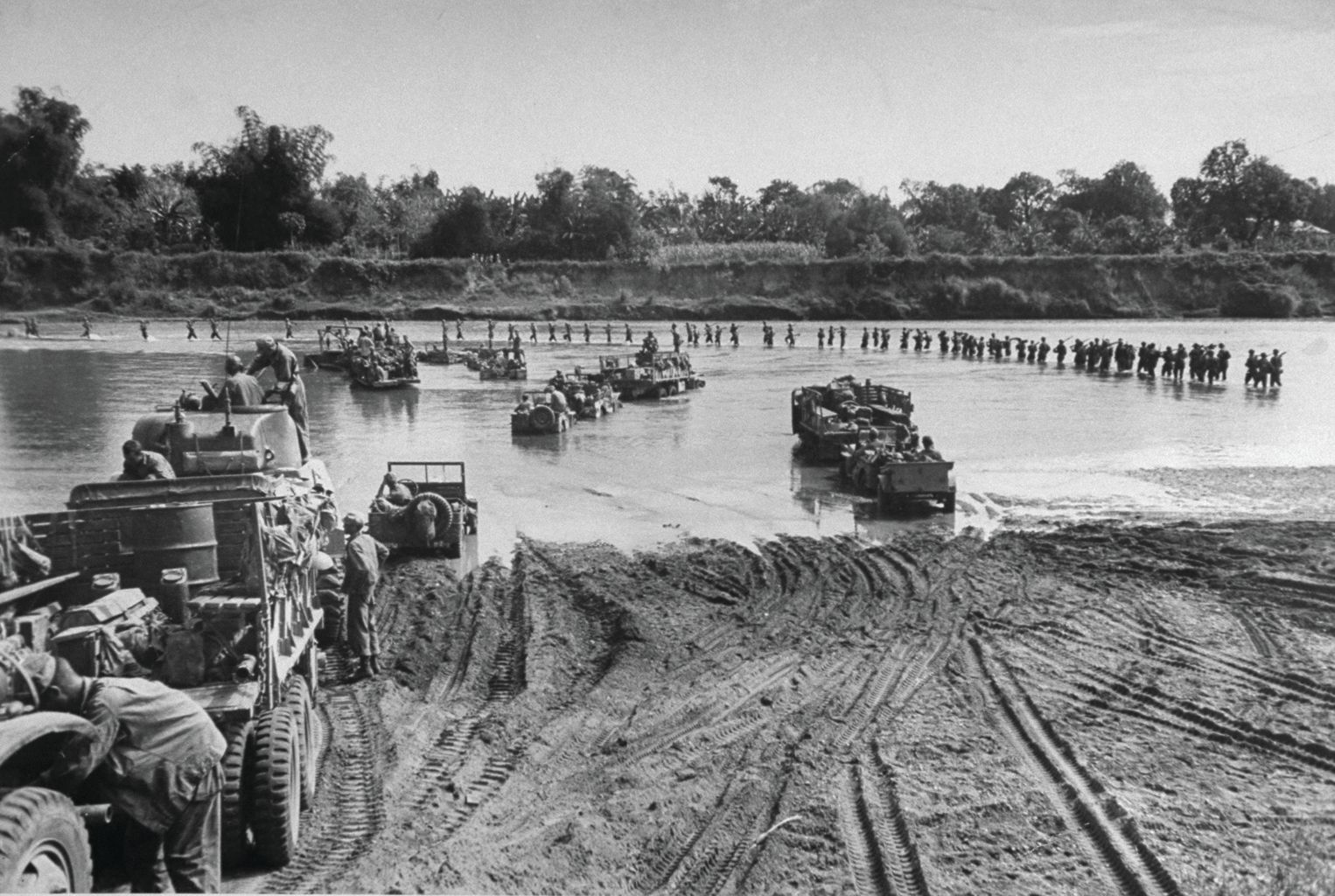 Troops and vehicles of the experienced 1st Cavalry Division cross the Pampanga River during the drive on Manila, January 31, 1945. The 1st Cav used the Marines’ close air support to help capture a key bridge into the city.