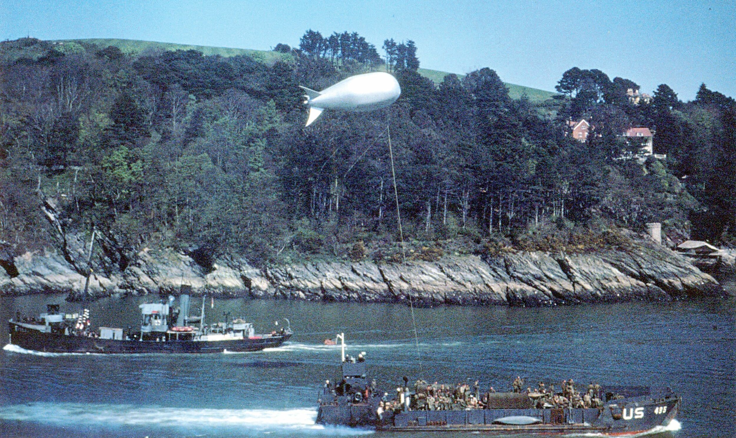 Under the protection of a barrage balloon, a Landing Craft Patrol heads to Slapton Sands, a British beach similar to the Omaha and Utah Beaches of Normandy.