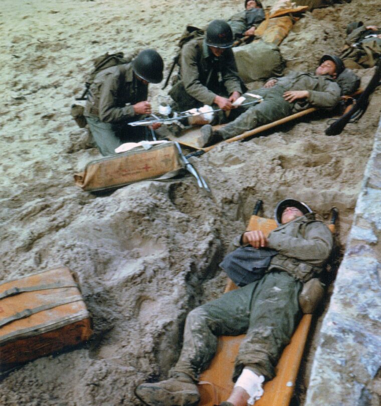 Navy corpsmen practice mending wounded soldiers. This training would come into heavy practice on June 6, 1944.