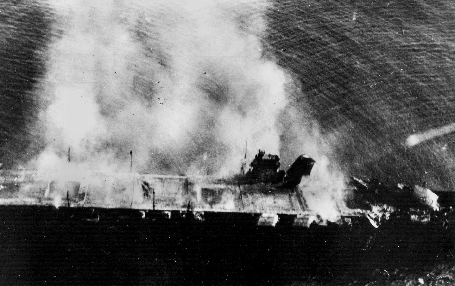 Stricken Japanese carrier Hiryu is photographed from a friendly plane as it burns and sinks. Admiral Tamon Yamaguchi chose to go down with his ship.