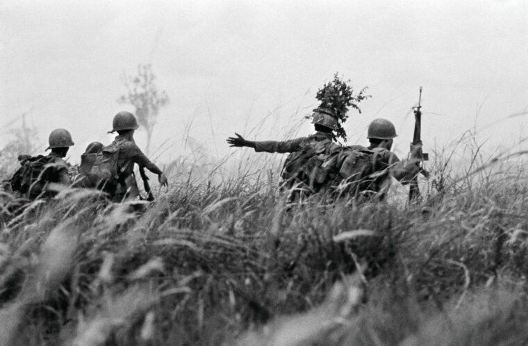 South Vietnamese troops advance through waist-high grass toward North Vietnamese invaders in May 1972 following the NVA’s all-out Easter offensive of 1972.