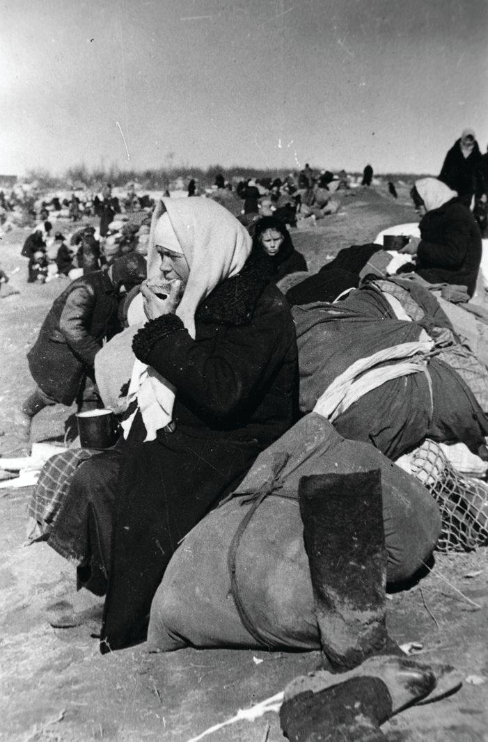 Evacuated residents of Leningrad await transportation and ponder their future after crossing Lake Ladoga in April 1942.