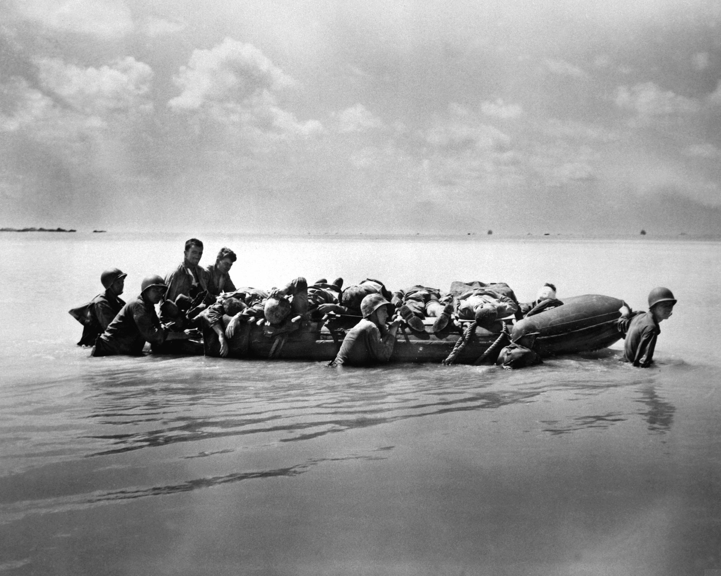 Many of the wounded Marines had to be ferried out to the edge of the coral reef aboard rubber boats like this one for evacuation to larger vessels that would take them to hospital ships offshore.