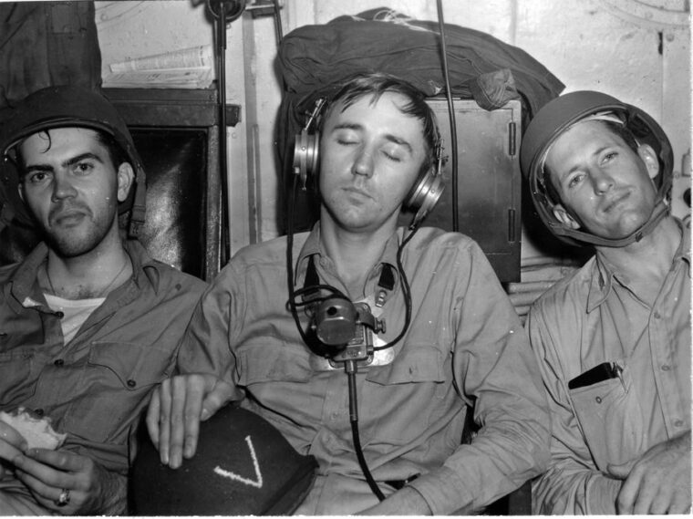 Exhausted Chicago crewmen photographed by their captain, Howard Bode, the day after the battle.