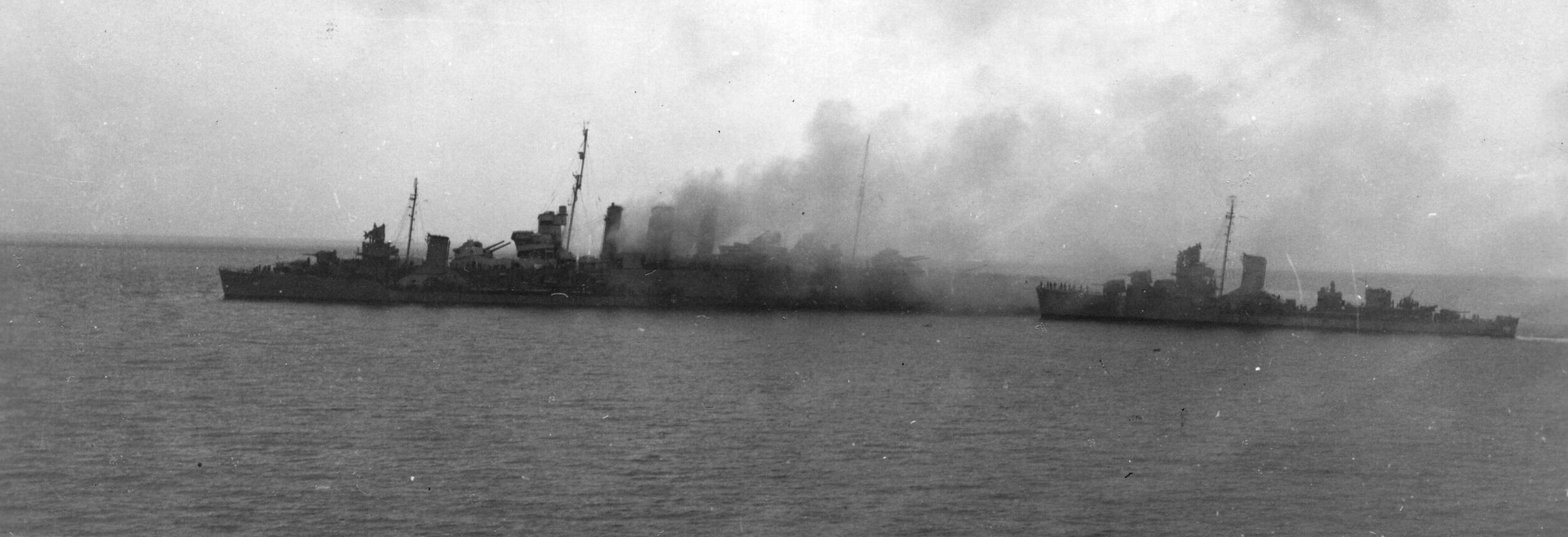 A still-smoking Canberra, the day after the battle. She was sunk by friendly fire.
