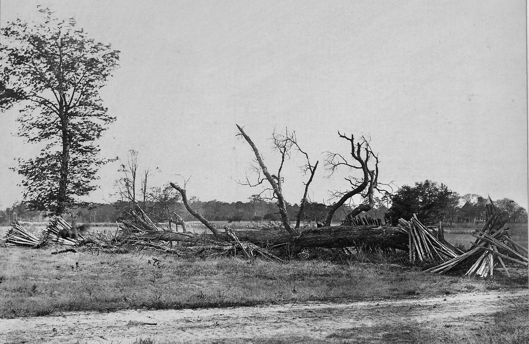 A blurry horseman is visible at the far left of this period photograph of hastily constructed breastworks on the far left of the Confederate line at Cold Harbor.