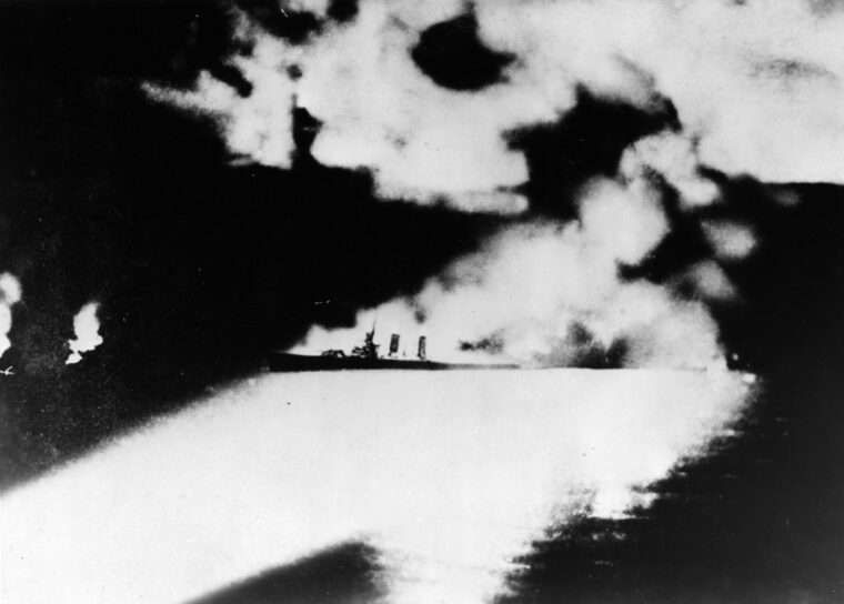 The doomed Quincy, photographed from a Japanese ship shortly before being sunk.
