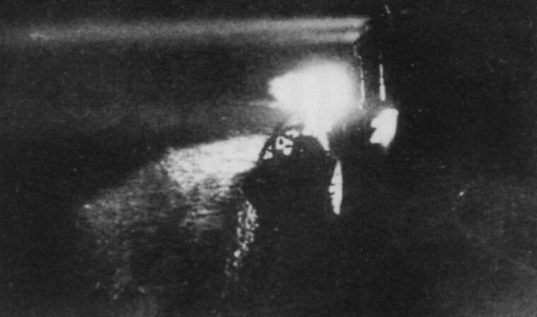 Japanese cruiser Yubari uses searchlights to locate the Allied fleet.