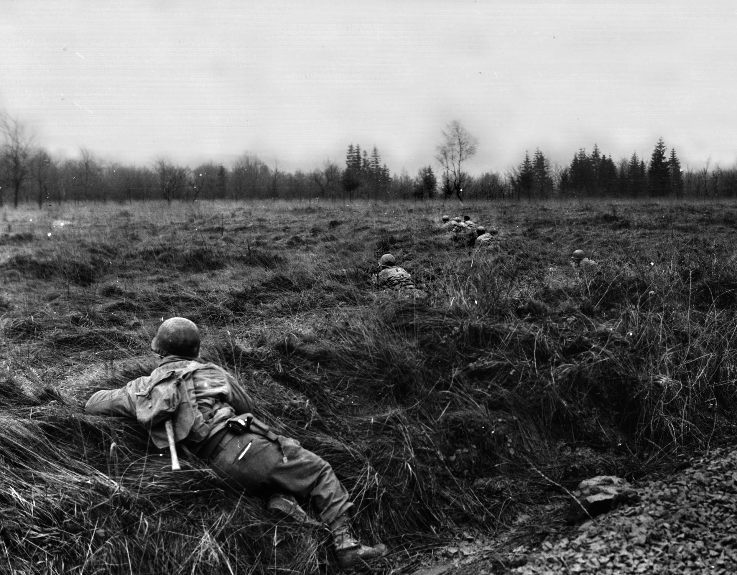 A lone GI scans the Belgian countryside for advancing Germans during the first days of the Battle of the Bulge.