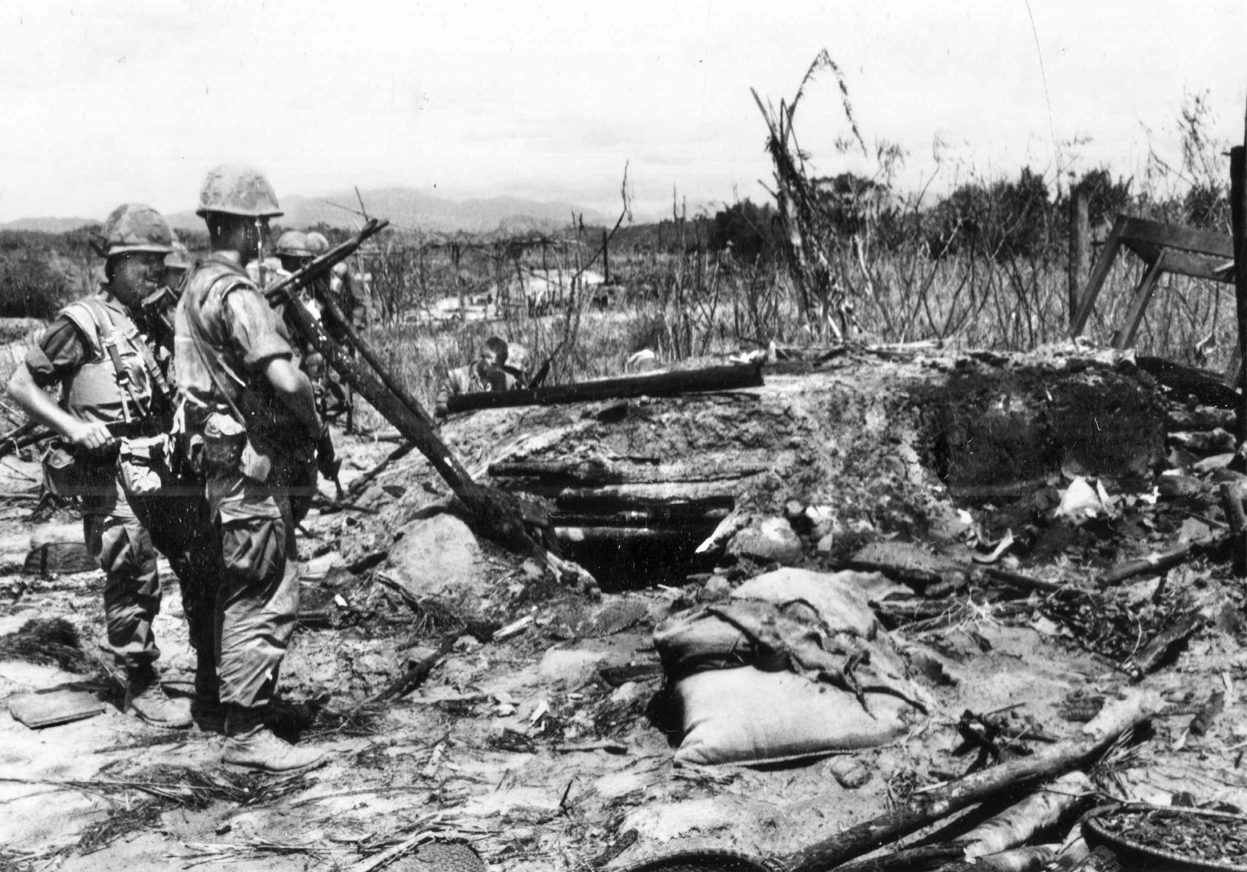 Marines search an abandoned enemy bunker shortly after the nighttime assault on Con Thien. Immediately after the attack, the Marines discovered a North Vietnamese army underground complex 2,000 yards north of Con Thien that included a regimental command post.