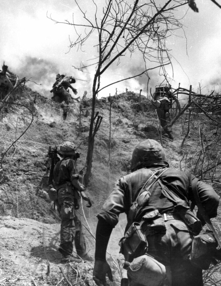 Marines assault entrenched North Vietnamese forces during Operation Hastings in July 1966. That year the Marines changed their focus from pacification of the populated coastal lowlands to countering enemy infiltration south of the DMZ.