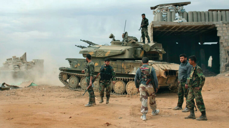 The crew of a ZSU-23-4 of President Bashar al-Assad's Syrian Armed Forces stands beside their ZSU-23-4. Introduced as a mobile air defense system during the Cold War in the 1960s, the ZSU-23-4 remains in use in 30 countries.