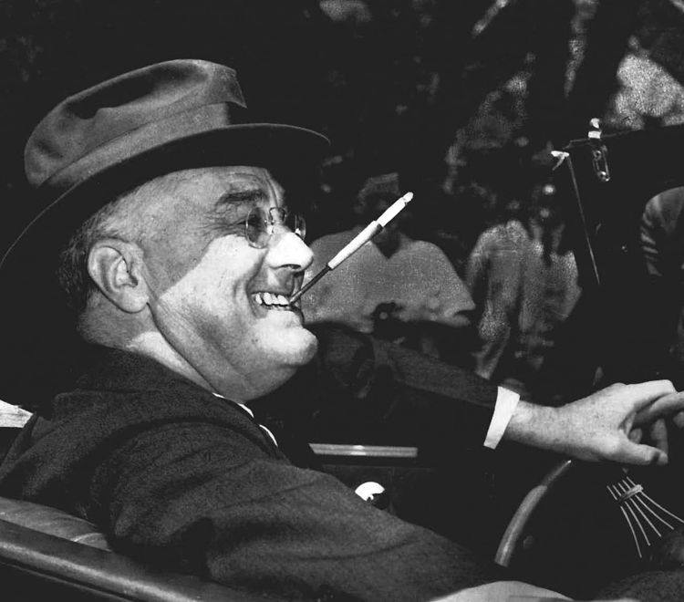 The familiar FDR smile and jaunty cigarette holder inspired cartoonists the world over.