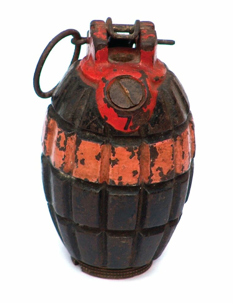 The classic British hand grenade used throughout both world wars. The painted stripes were used to differentiate the various grenade types.