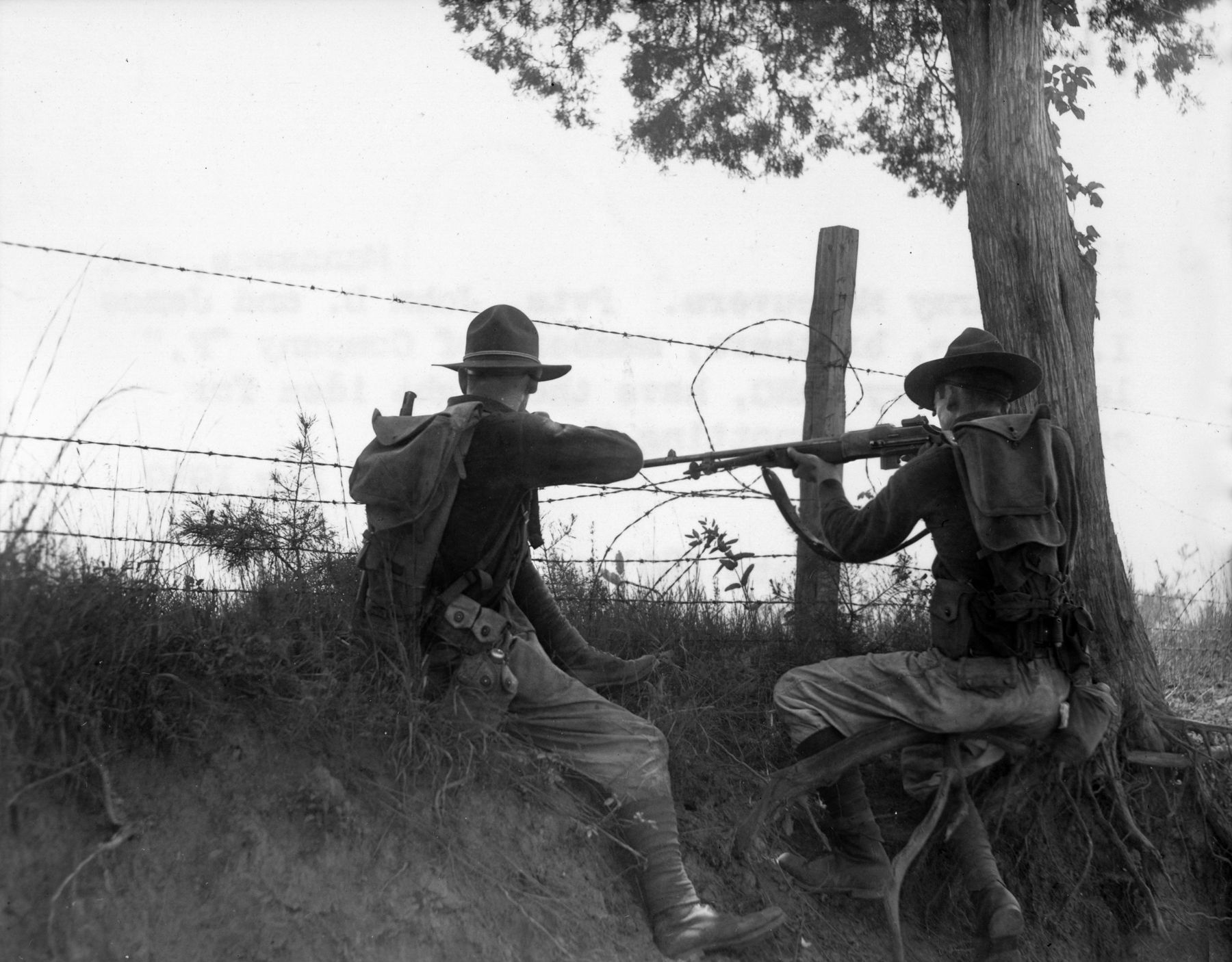 BELOW: A pair of National Guard soldiers fires their weapons during maneuvers in Manassas, Virginia. The soldier on the right fires a Browning Automatic Rifle (BAR).