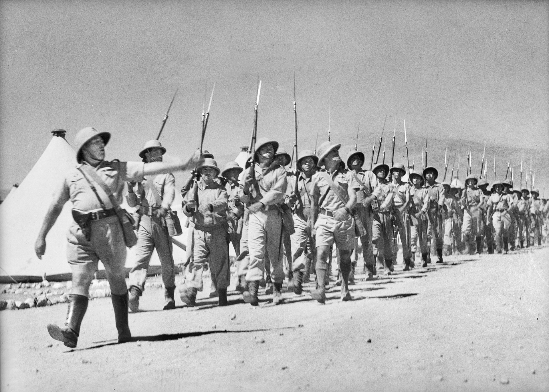 Free French troops, part of two brigades brought in to fight against their countrymen, march on parade near Damascus once the city fell on June 22, 1941. 