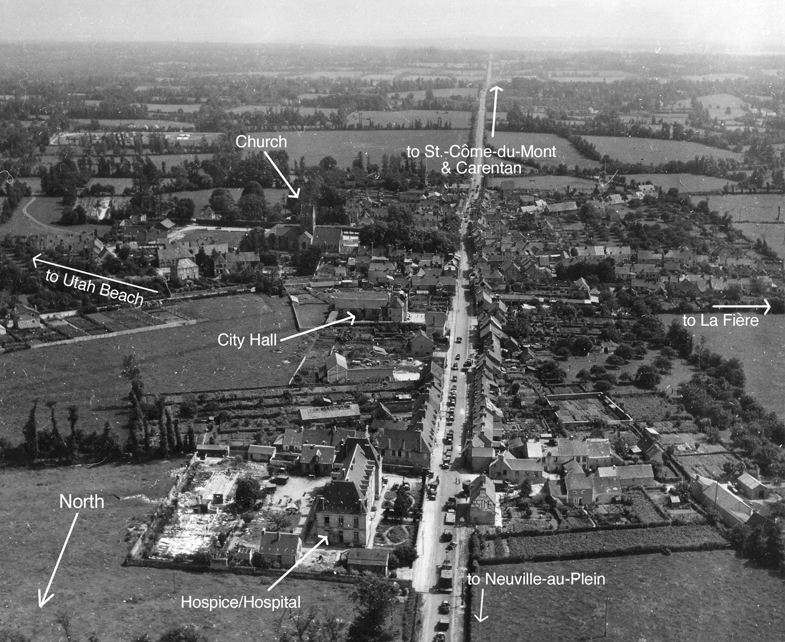 Aerial photo of Sainte-Mère-Église after its capture.  Note American military vehicles lining the main street. 